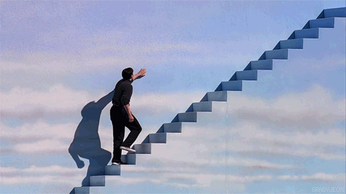 gif of man walking about a staircase with painted clouds