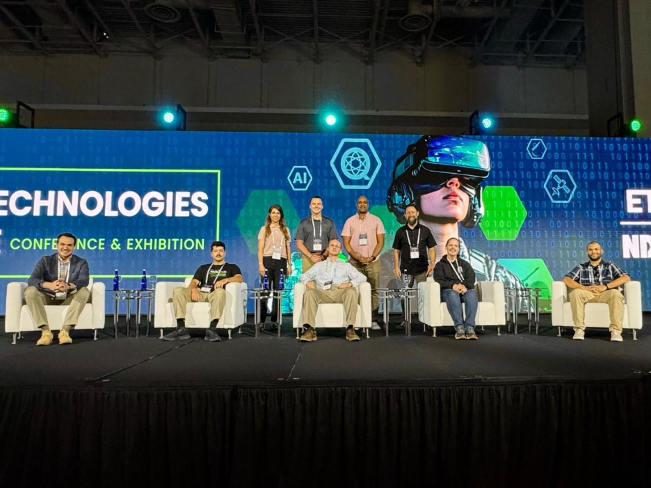 A group of people on a stage

AI-generated content may be incorrect.