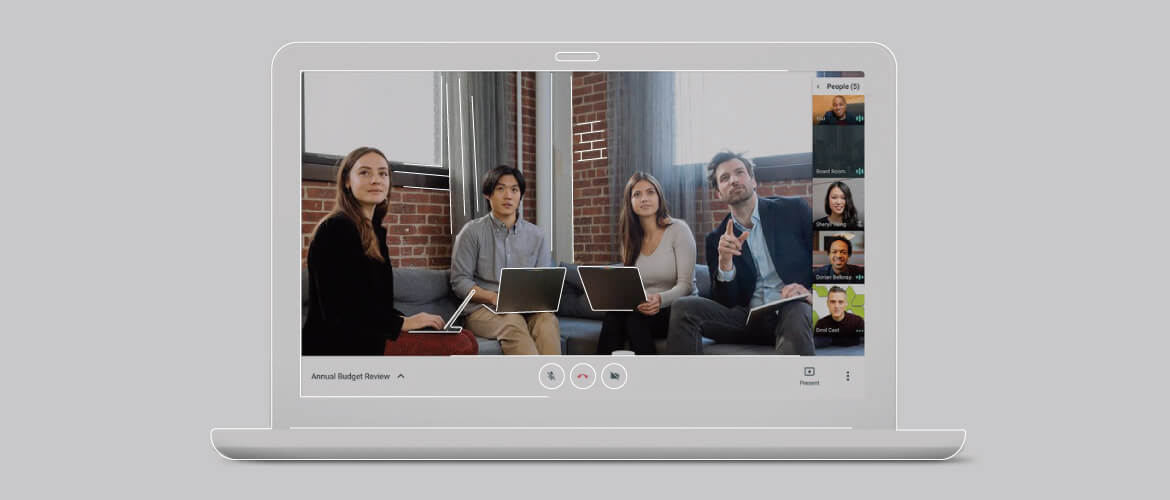 employees sitting in an office setting together on a video call