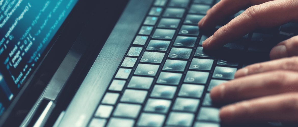 fingers typing on keyboard